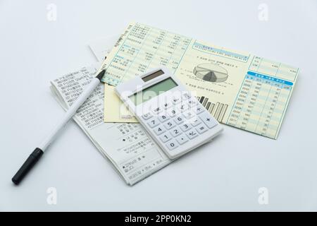 Tax related concept with various utility bills and receipts Stock Photo