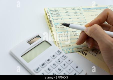 Tax related concept with various utility bills and receipts Stock Photo