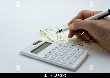 Tax related concept with various utility bills and receipts Stock Photo