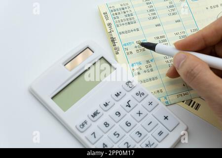 Tax related concept with various utility bills and receipts Stock Photo