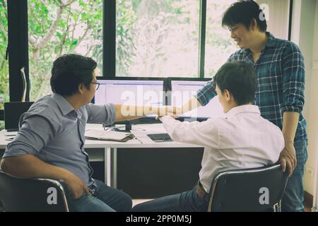 Programmers team joined hands in a software developing. Developing programming and coding technologies. Website design. Cyber space concept. Stock Photo