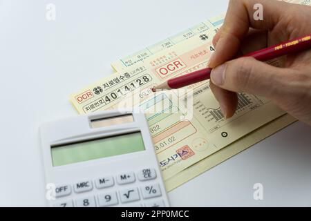 Tax related concept with various utility bills and receipts Stock Photo