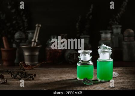 Witchcraft still life concept with potion, herbs ingredients candles and magical equipment Stock Photo