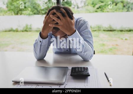 Architect in stress, tired, sad, disappointed with project problem. Stock Photo