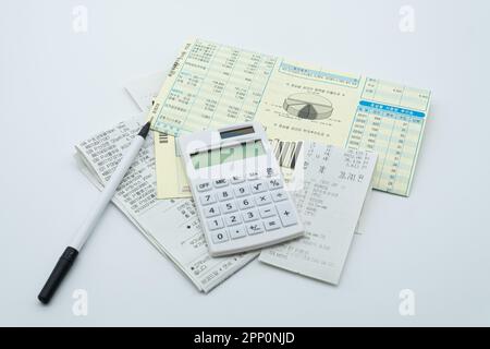 Tax related concept with various utility bills and receipts Stock Photo