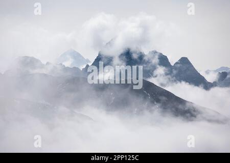 The top of Mount Everest encircled with clouds on the border of Nepal and Tibet. Stock Photo