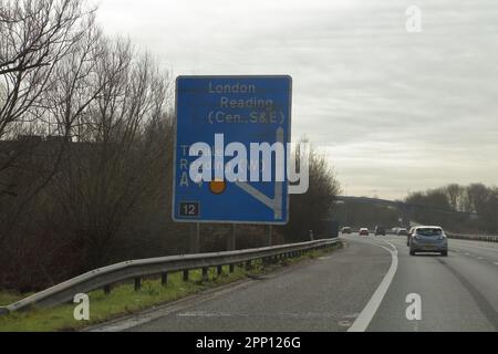 The junction sign for Theale and Reading at Junction 12 on the M4 motorway heading East. Stock Photo