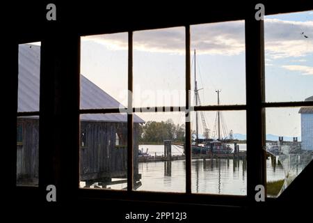 Britannia Shipyards Harbour Dock Heritage Window. Dock view through a window of the historic Britannia Heritage shipyard on the banks of the Fraser Ri Stock Photo