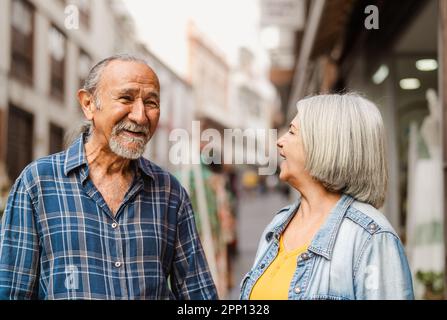 Happy senior couple having fun in city - Elderly people and love relationship concept Stock Photo