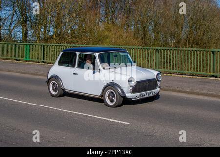 1973 70s seventies 1970s Rover Mini Mayfair Auto White Car Saloon Petrol 1275 cc; crossing motorway bridge in Greater Manchester, UK Stock Photo