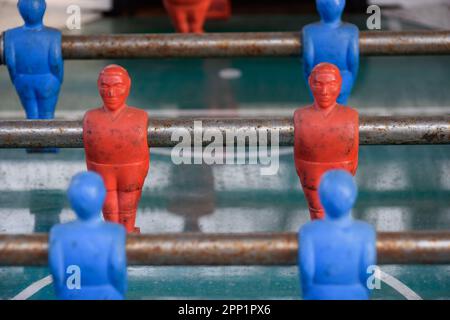 Red and blue plastic soccer and football figures for playing. Teamworking, Coworking, Team, Squad and Work in group concept. Stock Photo