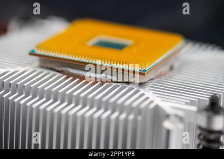 Back of a AMD socket AM4 CPU mounted on a cooler Stock Photo