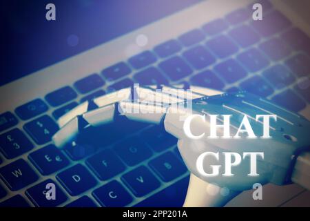 Florence , Italy April 19th 2023. ChatGPT neon light sign concept, open ai chat gpt bot and artificial intelligence technology. Robot hand typing on c Stock Photo