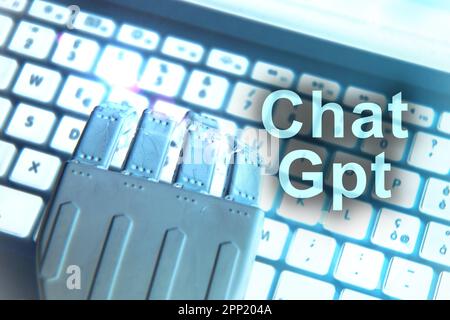 Florence , Italy April 19th 2023. ChatGPT neon light sign concept, open ai chat gpt bot and artificial intelligence technology. Robot hand typing on c Stock Photo