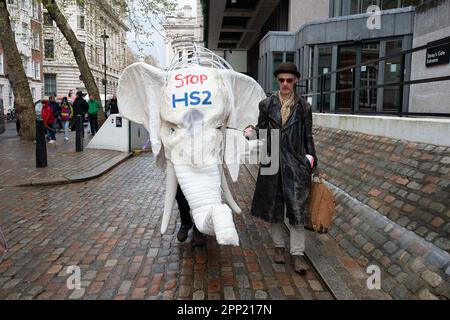 Westminster, London, UK. 21st April, 2023. Nellie the White Elephant from Stop HS2 joined the Extinction Rebellion, The Big One, Unite to Survive protesters in London today. The HS2 High Speed Rail link is hugely over budget as the tunnelling for Euston has been put on hold for financial reasons. Credit: Maureen McLean/Alamy LIve News Stock Photo