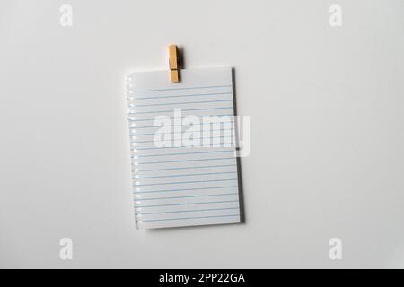 Blank note page paper on white background. Copy space. Close up. Stock Photo