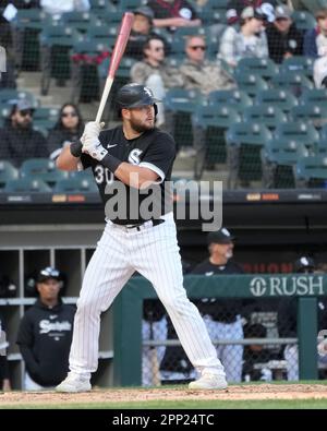 Chicago White Sox's Jake Burger swings at a pitch in a baseball