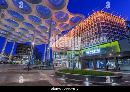 UTRECHT, NETHERLANDS - FEBRUARY 28, 2020: Utrecht Centraal Railway Station from Station Square with Hoog Catharijne shopping mall at twilight. Stock Photo