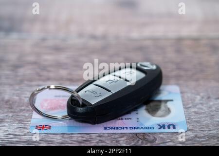 Modern latest style of UK Driving License with a car key fob Stock Photo