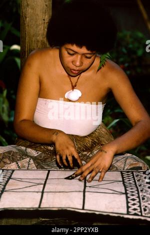 Woman applying design to tapa cloth, Pacific Harbour Cultural Centre, Viti Levu, Fiji Stock Photo