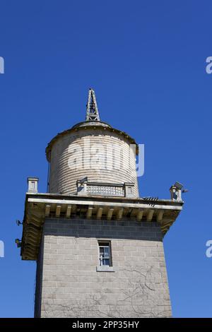 Wooden, water tower that is falling apart at Harkness Memorial State Park.  It used to be an estate with a working farm. Stock Photo