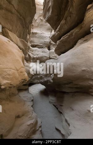 A narrow passage through The Slot, a slot canyon hiking trail in Anza Borrego Desert State park. Stock Photo