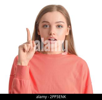 Young woman in red sweatshirt with raised index finger on white background, closeup Stock Photo