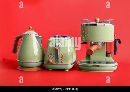 Set of red kitchen home appliances. Toaster, kettle, coffeemaker Stock  Illustration by ©alexlmx #155833816