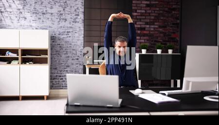 Stretch Exercise Workout At Office Business Desk Stock Photo