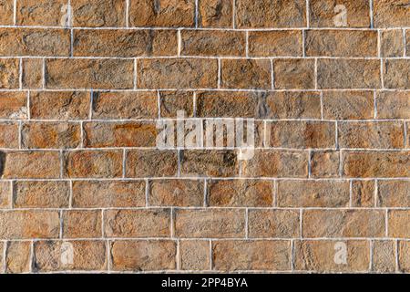 The red brick wall with white plastering in an ancient south indian temple made with natural granite in  sharp resolution Stock Photo