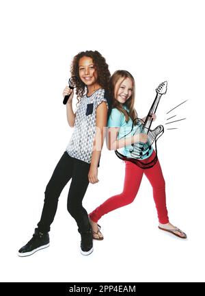 Any requests from the audience. Studio shot of two girls singing and playing music on imaginary instruments. Stock Photo