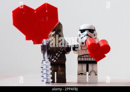 Lego Chewbacca and a Lego Stormtrooper holding Lego hearts Stock Photo