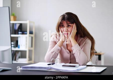 Unhappy Stressed Woman Using Computer In Office. Frustrated Staff Stock Photo