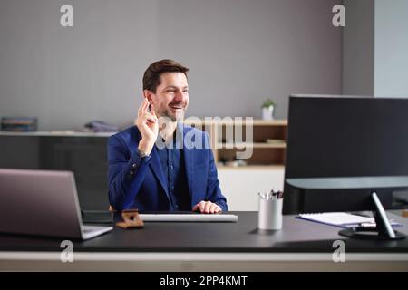 Businessman Having Ah Ha Moment While Working In Office On Laptop Stock Photo