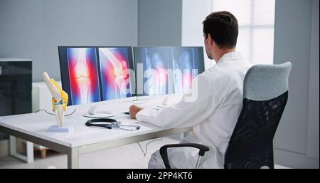 Dentist Using Computer Technology Dental Software For Teeth Xray Stock Photo