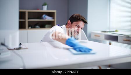 Professional Workplace Janitor Service. Office Desk Cleaning Stock Photo