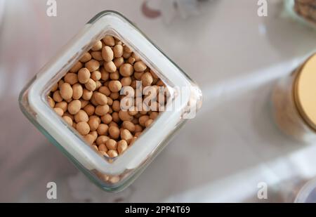 top view of floured fried peanuts in a jar Stock Photo
