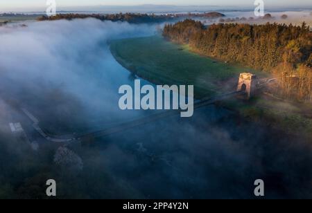 The Union Chain Bridge is a suspended-deck suspension bridge that spans the River Tweed between Horncliffe on English side and Fishwick on the Scottis Stock Photo