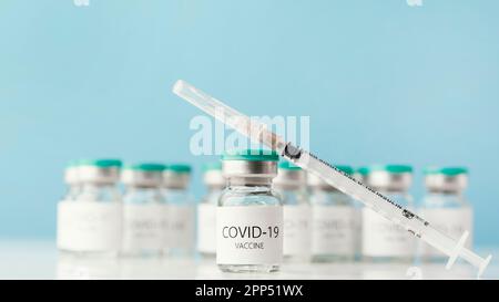 Arrangement with coronavirus vaccine bottle Stock Photo
