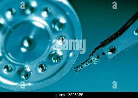 Macro of an open computer hard drive with the read write head Stock Photo