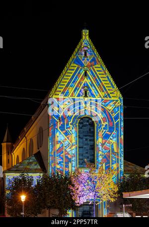 AUGSBURG, GERMANY - OCTOBER 24: Illuminated historic Moritz church at the festival of lights in Augsburg, Germany on October 24, 2021 Stock Photo