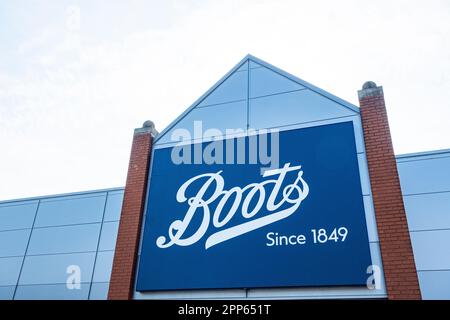 Boots the chemist sign or logo on outside wall UK Stock Photo