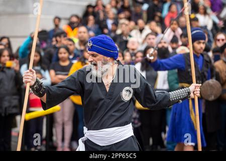 London, UK.  22 April 2023.  A member of the Baba Fateh Singh Gatka Academy, a group of traditional martial artists, takes part in the Vaisakhi festival in Trafalgar Square.  The event marks the Sikh New Year and is a celebration of Sikh and Punjabi culture. Credit: Stephen Chung / Alamy Live News Stock Photo