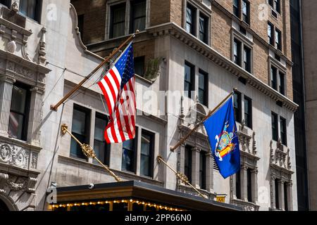 Flag of the United States and Flag of New York State on the building in New York City, NY, USA, August 21, 2022. Stock Photo