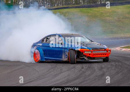 Modified BM E12 with Chevrolet engine at Three Sisters Race Circuit Drift Day of motorsports action, burning rubber and tires screeching in Wigan, Lancashire UK Stock Photo
