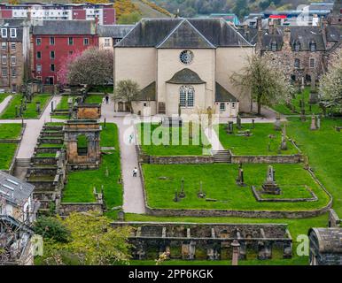 View of rear exterior of Canongate Church and graveyard with old graves, Royal Mile, Edinburgh, Scotland, UK Stock Photo