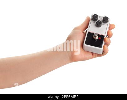 guitar fuzz pedal in hand path isolated on white Stock Photo