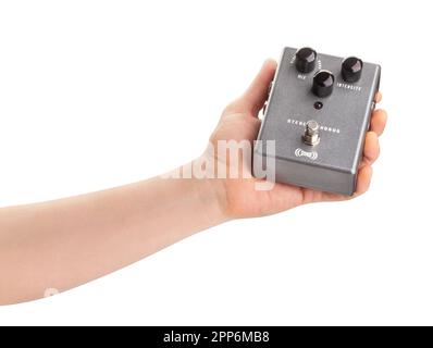 guitar pedal in hand path isolated on white Stock Photo