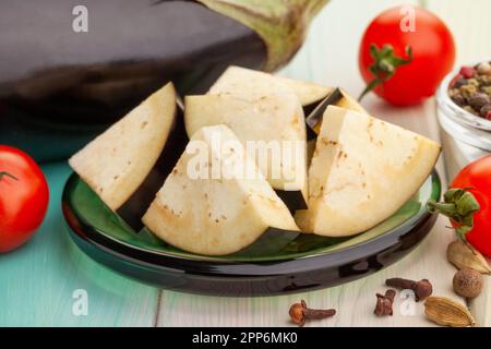 sliced eggplant on wood background Stock Photo