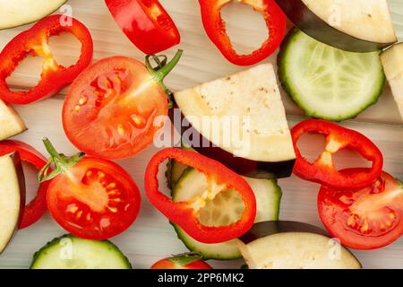sliced vegetables on wood background Stock Photo